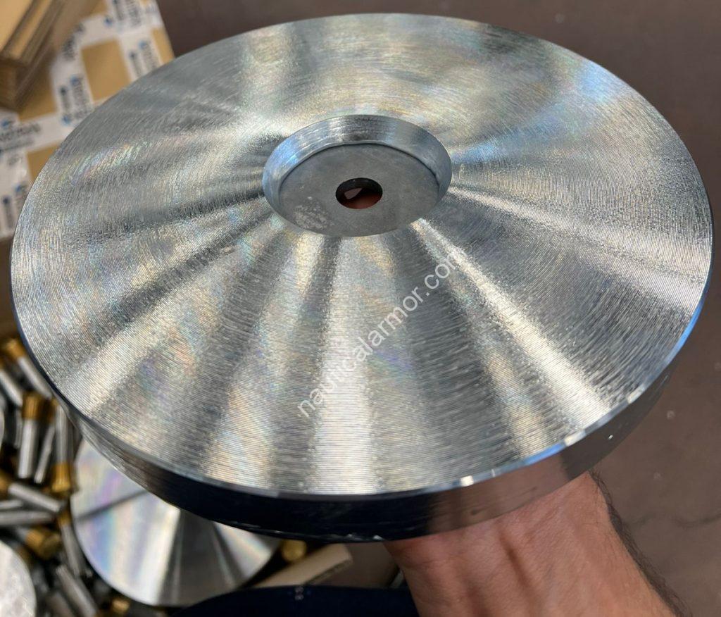 Large Nautical Armor stern sacrificial anode held in hand during inspection.