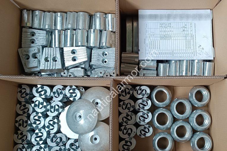 Open boxes of mixed Nautical Armor sacrificial anodes arranged for clear sorting and receiving, with the packing list visible.