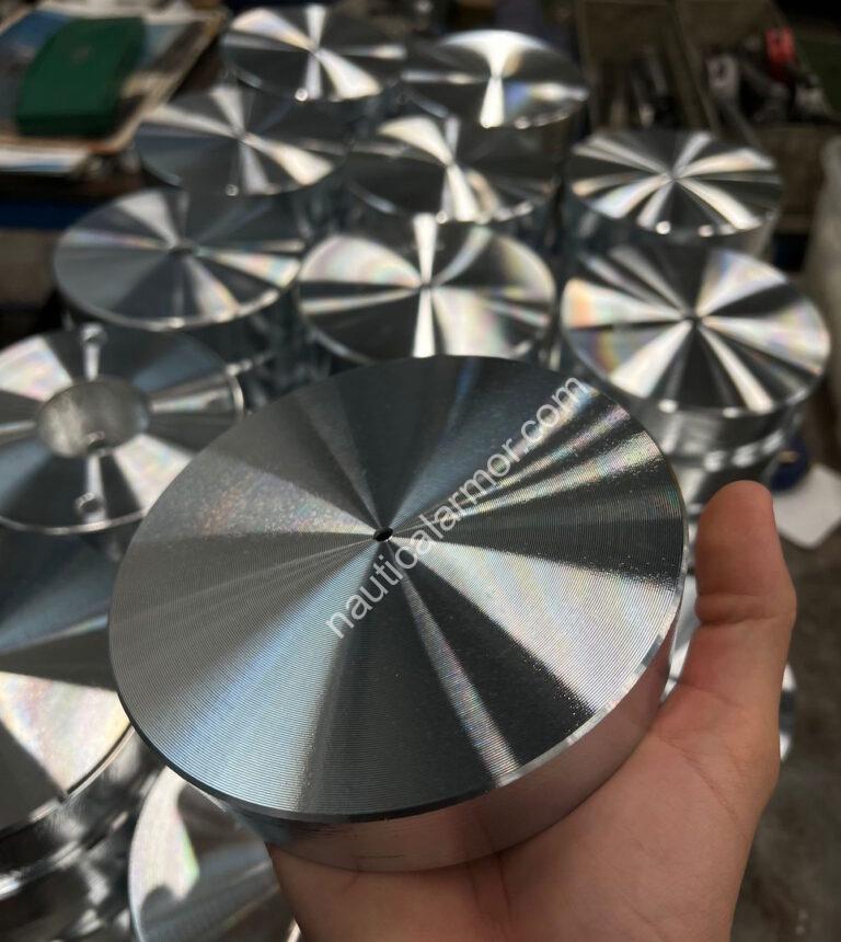 Nautical Armor - hand inspection of a stern sacrificial anode to verify finish and fit before sealing the shipment.