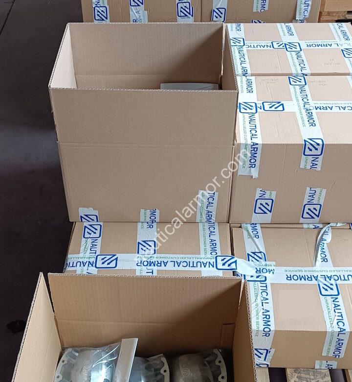 Nautical Armor staged shipment with open boxes and packed pallets of sacrificial anodes in the warehouse.
