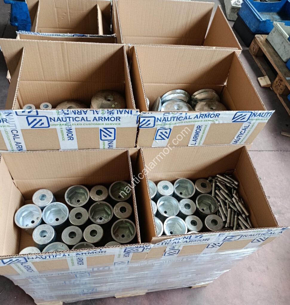 One Nautical Armor pallet with open boxes showing packed sacrificial anodes and hardware ready for dispatch.