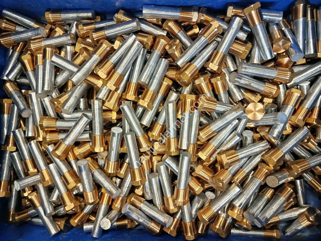 Large quantity of Nautical Armor pencil sacrificial anodes with brass plugs prepared for shipment.