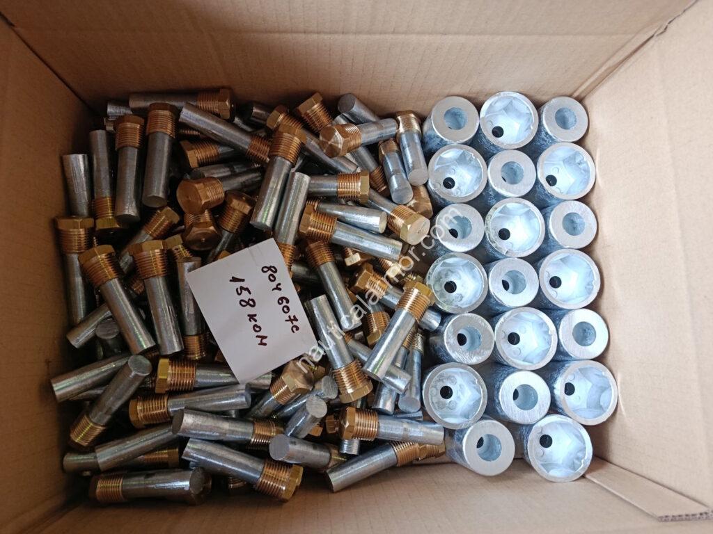 Open box containing mixed Nautical Armor sacrificial anodes, including pencil anodes and propeller anode components packed for dispatch
