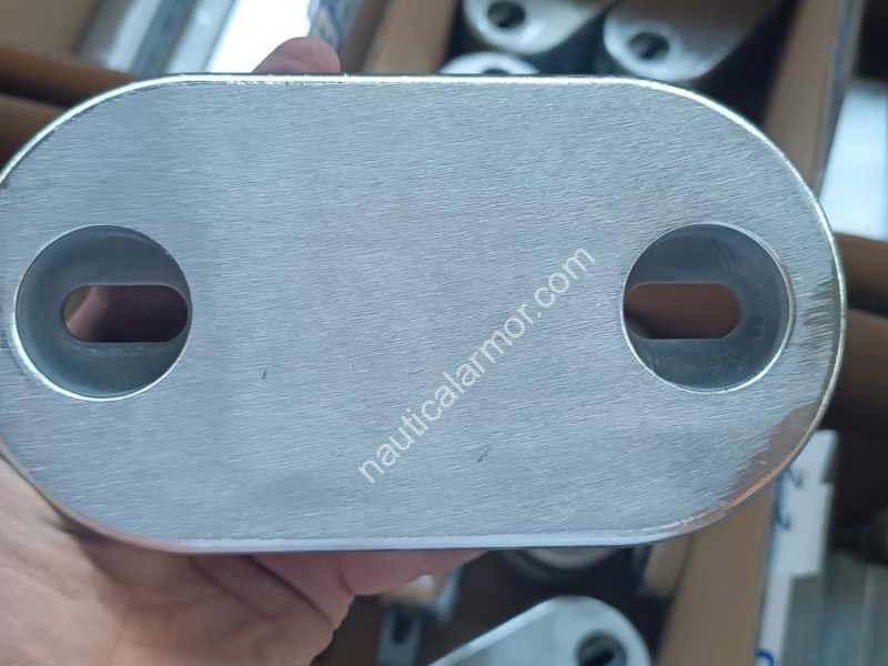 Nautical Armor bolt on anode 266 held in hand during inspection, close up of finish and mounting holes